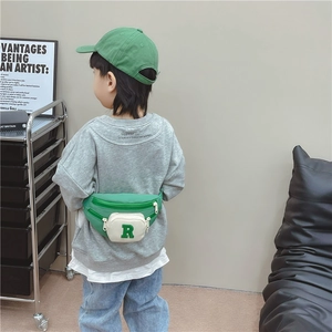 Kids neon green crossbody bag with contrast pocket and embroidered R letter for toddlers