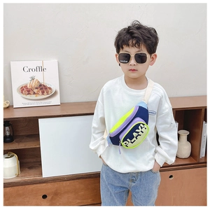 Detailed view of kids crossbody bag with vibrant color-blocking and PLAY! letter print
