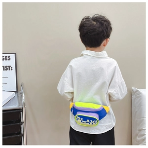 Close-up of children's colorful crossbody bag with PLAY! text and adjustable strap