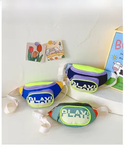 Detailed view of kids crossbody bags in vibrant color blocks with adjustable white straps