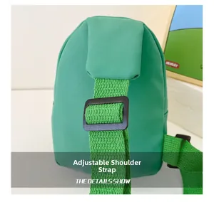 Detail of green nylon kids chest bag showing adjustable strap and durable buckle
