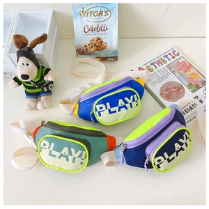 Close-up of children's nylon crossbody bags with PLAY! print and adjustable straps
