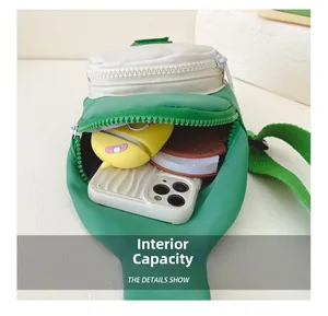 Detail view of the nylon chest bag interior showing space for phone and earphones