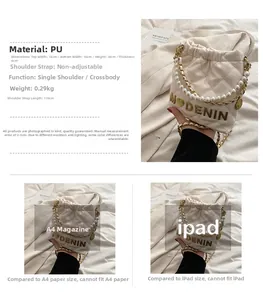 Detailed view of white quilted bucket bag with pearl strap and golden chain trim