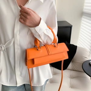 Orange minimalist PU leather shoulder bag with top handle and adjustable strap
