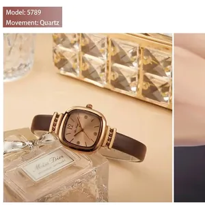 Elegant women's square quartz watch with gold metal case and brown leather strap