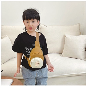 Detail of kids nylon crossbody chest bag with yellow color block and letter P patch