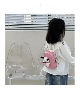 Pink toddler backpack with adjustable straps and a cute white puppy plush toy charm