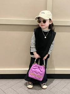 Fashionable girl's purple quilted handbag with pearl handle and stylish spring outfit