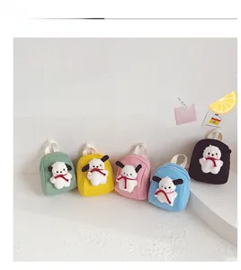 Detail of five colorful canvas mini backpacks featuring cute plush puppy doll ornaments