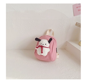 Close-up of pink canvas backpack featuring a 3D plush puppy character and adjustable straps