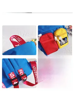 Detail view of the colorful canvas kid backpack showing red handles and blue mesh pockets
