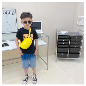 Kids casual outfit featuring a bright yellow crossbody chest bag with GAME letter print