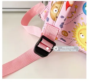 Close-up of adjustable pink shoulder strap and buckle on kids cartoon space backpack