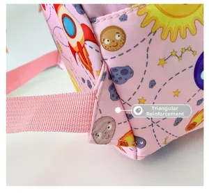 Close-up of triangular reinforcement stitching on kids' pink space dinosaur backpack