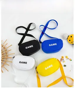 Flat lay of mini canvas crossbody bags in black, blue, white, and yellow with GAME text