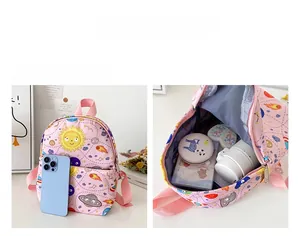 Internal view of pink toddler backpack showing large capacity and space-saving design