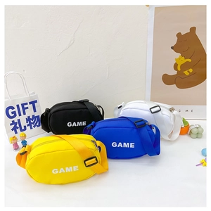 Detailed view of colorful canvas mini bags in yellow, blue, black and white for children