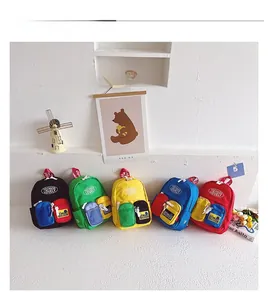 Detail view of colorful mini backpacks in five vibrant shades with contrast pockets