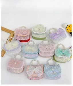 Collection of colorful tweed mini bags with pearl handles and organza bows for girls