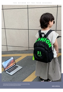 Close-up of lightweight kids canvas backpack with neon text and side mesh pocket