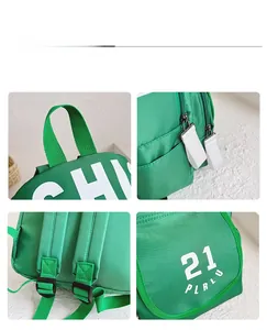 Detail view of green canvas backpack featuring waterproof fabric and adjustable straps