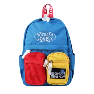 Blue and red canvas backpack for kids featuring color-block design and multi-pockets
