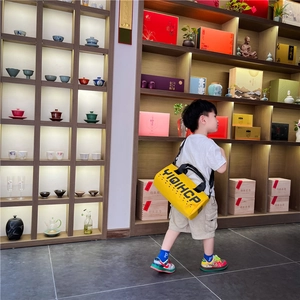 Sac bandoulière cylindrique jaune pour enfants en toile avec bandoulière réglable