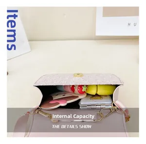 Pink bow handbag interior showing capacity for small cosmetics and cartoon mirror
