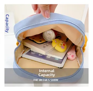 Detail view of the spacious inner storage of this kids backpack showing tablet and books
