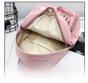 Pink toddler backpack interior view showing spacious main compartment and checkered accessory