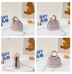 Detailed views of pink mini shell bag with rhinestones and silver chain strap