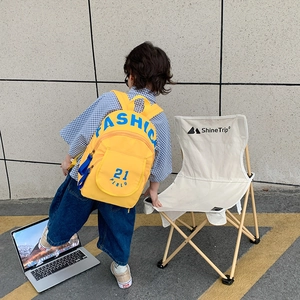 Vibrant yellow canvas backpack for toddlers featuring bold blue fashion lettering print