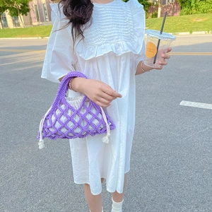 Vibrant purple woven net bucket bag for kids featuring a white drawstring inner pouch