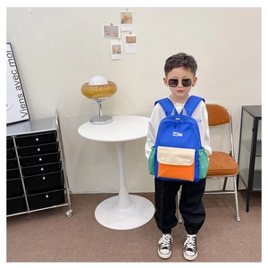Detail view of the colorful kids backpack with Fashion label and convenient side pocket