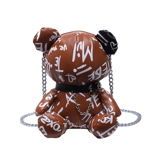 Graffiti teddy bear crossbody bag with brown leather and silver chain strap