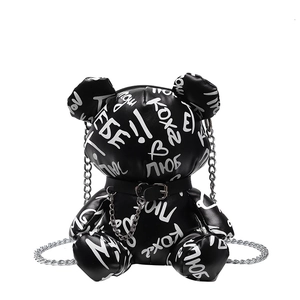Quirky bear crossbody bag in black leather with white graffiti prints and silver chain