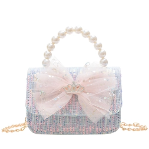 Chic girls woven crossbody bag with pink bow, pearl handle and gold chain strap