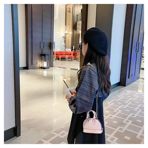 Pink mini shell bag with rhinestones shown on model for stylish girls' outfit accent