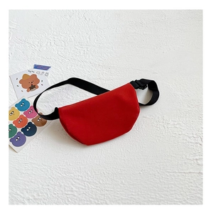 Detail of red canvas waist bag with adjustable black strap and buckle for kids