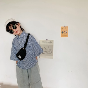 Stylish boys mini black crossbody chest bag with blue checkered shirt outfit