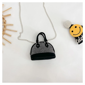 Detail of mini black velvet shell bag for girls with sparkling silver rhinestones