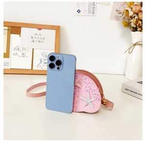 Pink sequin shell mini bag with starfish detail and size comparison to smartphone