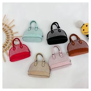 Detailed view of kids mini shell bags with sparkly rhinestones in six various colors