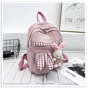 Pink rabbit backpack for kids featuring cute plush bunny ears and checkered ribbon details