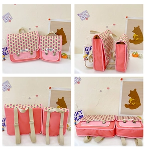 Detailansicht der pinkfarbenen Kinderrucksäcke mit Blumenmuster in zwei verschiedenen Größen