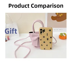 Pink mini PU crossbody bag with large bow detail shown next to a smartphone for size reference