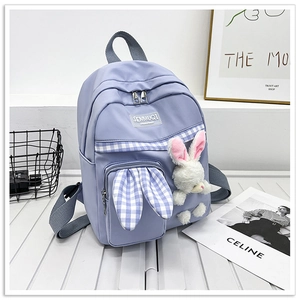 Detail of lavender canvas kids backpack with plaid bunny ears and plush rabbit pendant