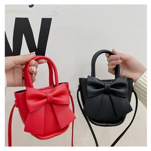 Red and black mini PU crossbody bags with decorative bows and round top handles