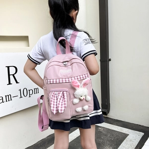 Pink toddler backpack with plaid pattern and cute plush rabbit charm for girls